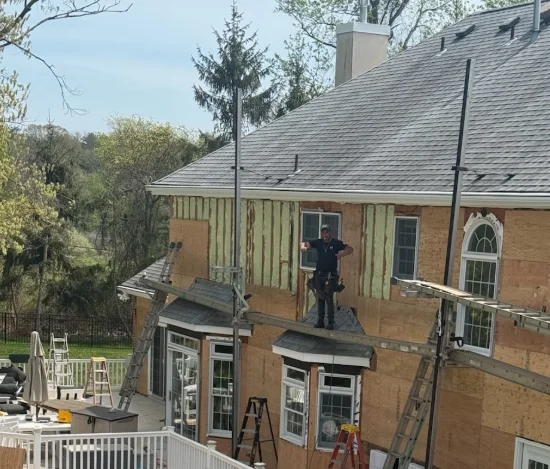 Residential roof installation on home exterior
